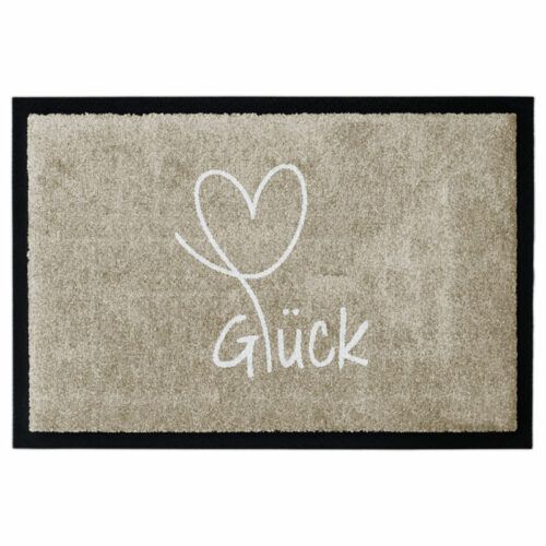 Waschbare Fußmatte von Glücksmatte.com mit einem Herz und der Aufschrift "Glück". Farbe Beige. Mit 2cm Gummirand. Umweltfreundlich in Deutschland hergestellt.
