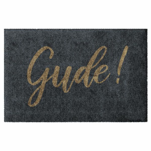 Waschbare Fußmatte von Glücksmatte.com mit Aufschrift "Gude!" in Goldbraun auf Anthrazit. Ohne Rand. Umweltfreundlich in Deutschland hergestellt.