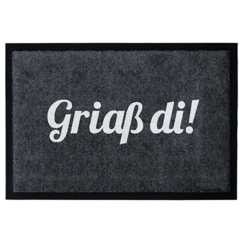 Waschbare Fußmatte mit dem Text Griaß di! in weiß auf schwarz. Mit Gummirand.