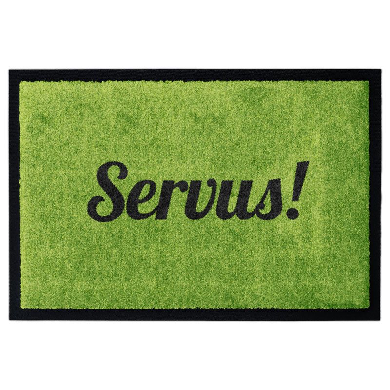 Waschbare Fußmatte von Glücksmatte mit dem Gruß "Servus!" in Schwarz auf Grün