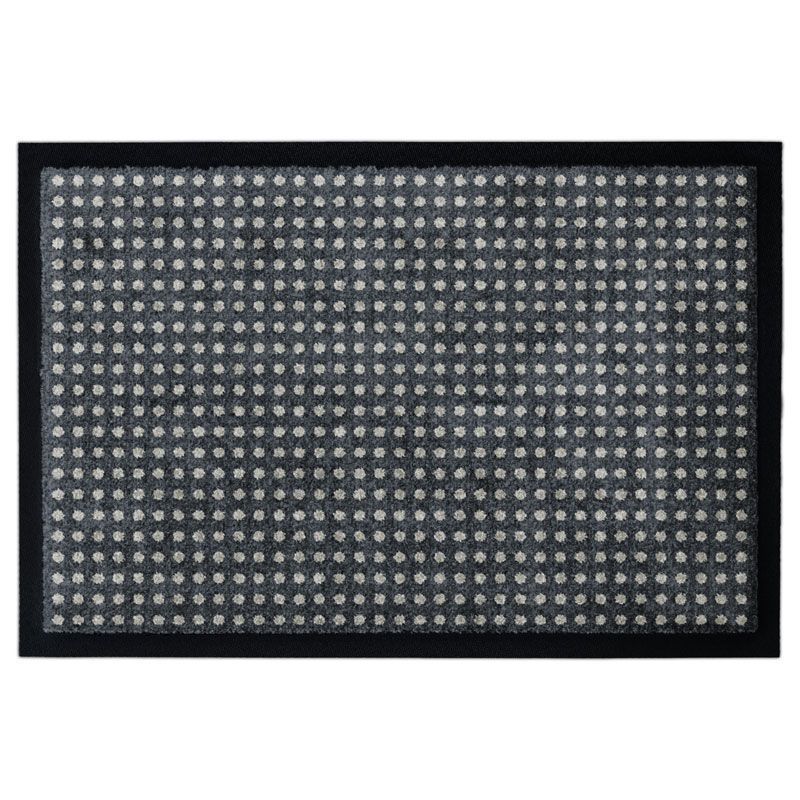 Schwarze Fußmatte mit vielen kleinen weißen Punkten